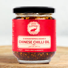 Load image into Gallery viewer, Jar of Curious Elephant Chinese Chilli Oil on a wooden surface with a white background